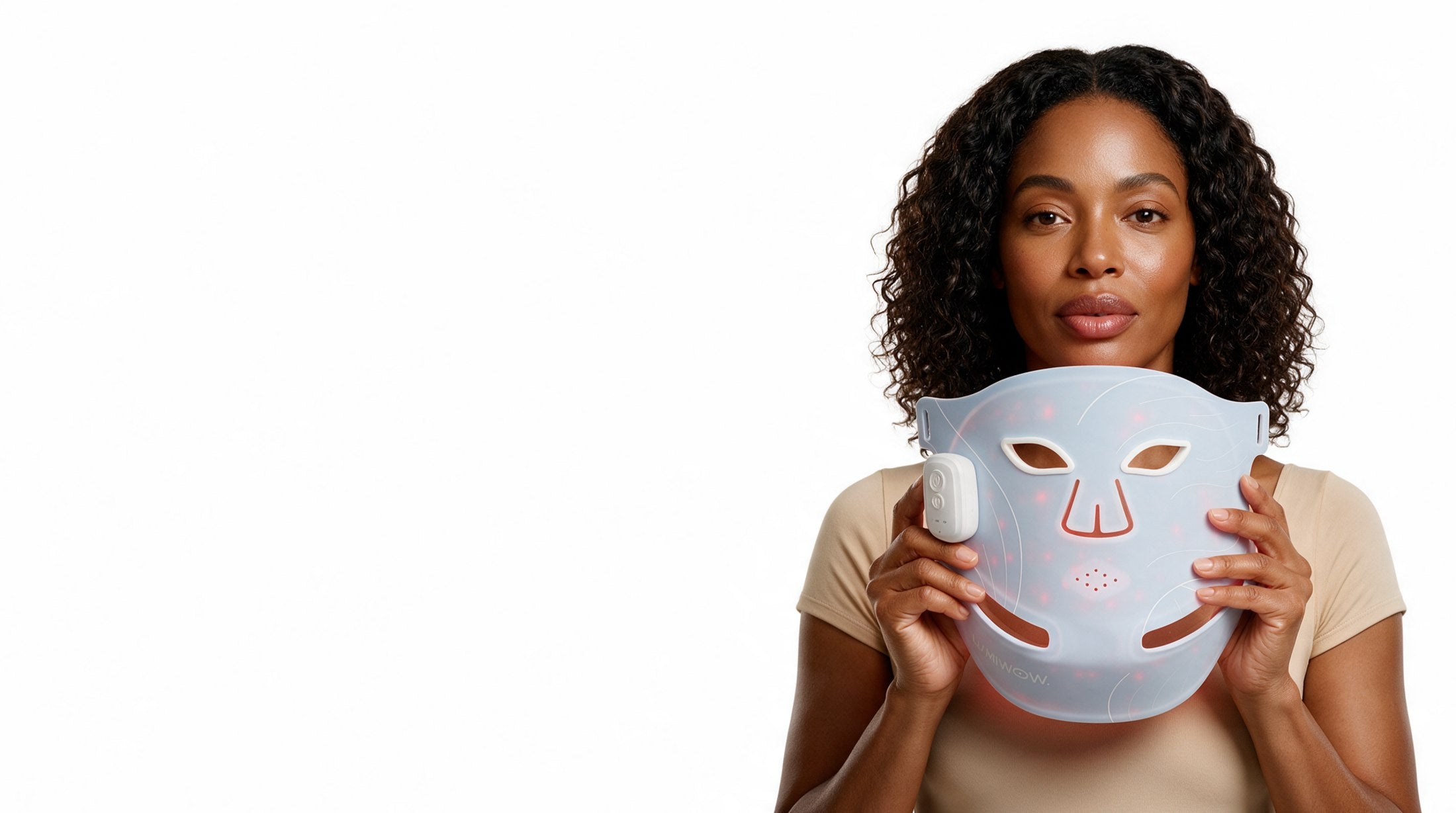 Woman holding the LUMIWOW LED light therapy mask